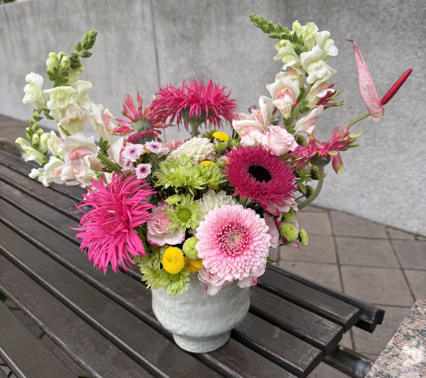 Pink peony and rose basket bouquet with pearls