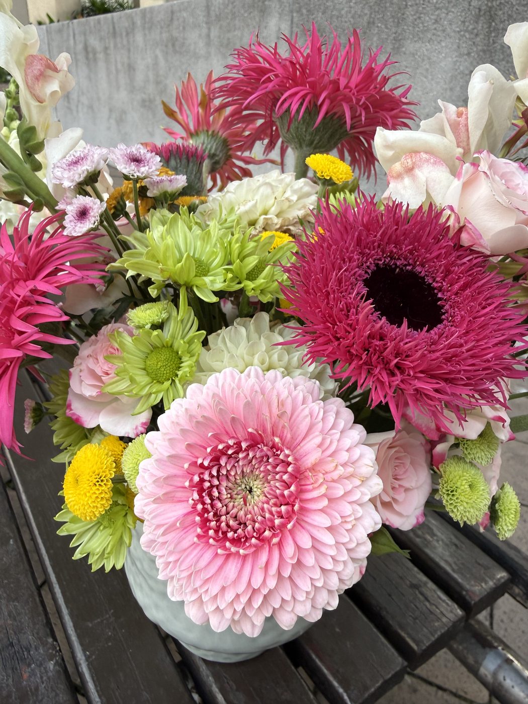 Basket arrangement with ribbon and mixed pastels