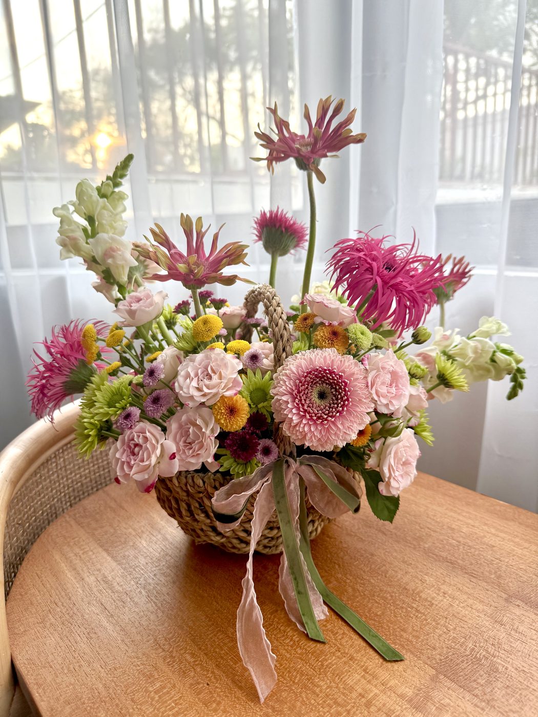 Pink gerbera and thistle arrangement